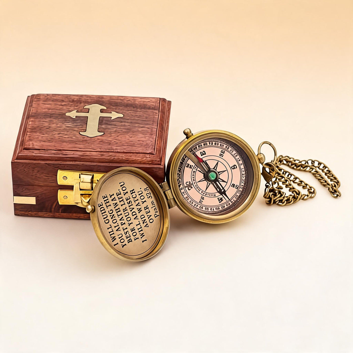 The Compass open showing compass rose and Psalm 32:8 engraving with wooden box and chain