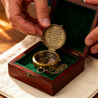 The Compass resting in its wooden box, lid open, Psalm 32:8 engraved in the brass