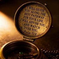 Close-up of the Psalm 32:8 engraving in natural brass