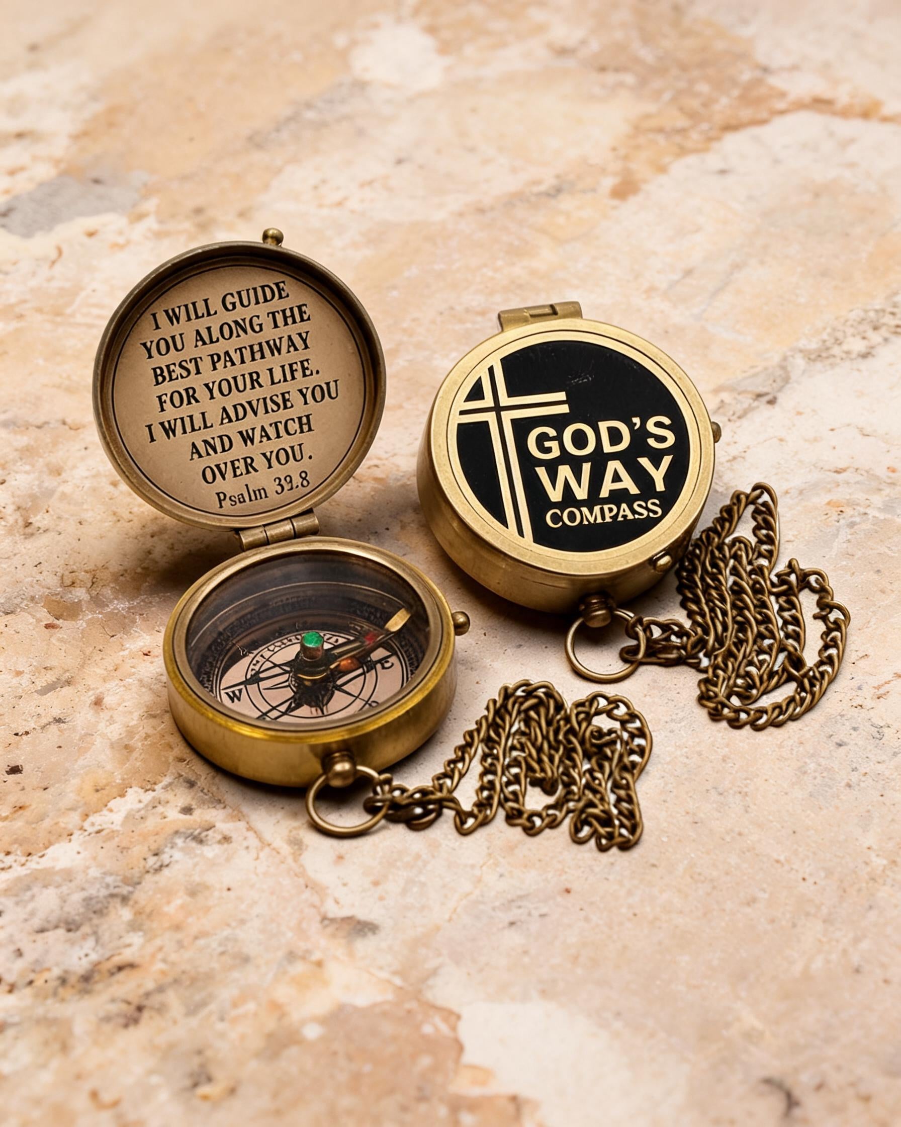 The Compass in its wooden box, lid open, brass chain coiled beside it